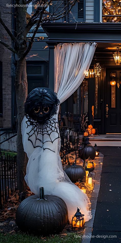 The use of black lace curtains and flickering candles brings a stylish Halloween transformation to your yard, making it both haunting and elegant. Halloween Gauze Front Porch, Halloween Shed Decor, Rooftop Halloween Decorations, Elegant Halloween Decor Outdoor, Halloween Yard Displays Diy, Halloween Rooftop Decorations, Halloween Gazebo, Classy Halloween Decor Outdoor, Halloween Birdcage