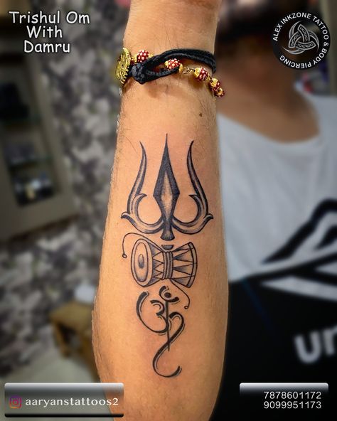 "Harnessing the power of the divine—Trishul, Damru, and Om: Symbols of protection, creation, and cosmic energy." Hashtags: #TrishulTattoo #DamruTattoo #OmTattoo #ShivaVibes #DivinePower #SacredSymbols #TattooArt #SpiritualInk #CosmicEnergy #ShivaShakti #TattooWithMeaning #Inkspiration #indiantattooartist Follow for more ⤵️ Aaryanstattoos2 Aaryan's Tattoos & Piercings Chandkheda Contact for booking ☎️ Chandkheda:7878601172 Motera:9099951173 9 first floor 4d square mall visat Gandhinagar roa... Trishul Damru Tattoo, Trishool Tattoo, Damru Tattoo, Aj Tattoo, Symbols Of Protection, Om Tattoo, Indian Tattoo, Shiva Shakti, Sacred Symbols