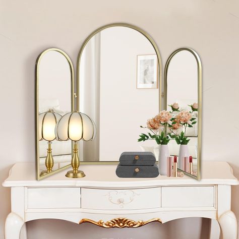 PRICES MAY VARY. ✦【Versatile & Functional】: This 2 in1 trifold mirror is designed to be versatile. It can be hung as a decorative mirror or standing on vanity as a 3-way makeup mirror. To adjust the angle of the golden frame mirrors each side for braiding hair, makeup and etc. When flat the trifold arched wall mirrors and hang it, large size mirror can brighten and complement your home decors. Besides, 3 pieces arch mirrors is large enough as bathroom mirrors or wash room mirror wall decor. ☾【St Trifold Bathroom Mirror, Large Mirror Vanity, Mirrored Makeup Vanity, Bedroom Vanity Mirror, Art Deco Vanity Mirror, Bedroom Mirrors Above Dressers, Vanity Mirror Ideas Bedrooms, 3 Mirror Vanity, Flare Aesthetic