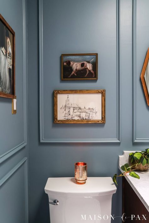 See how a 1980's standard space was transformed into a moody blue bathroom with elegant, timeless appeal.