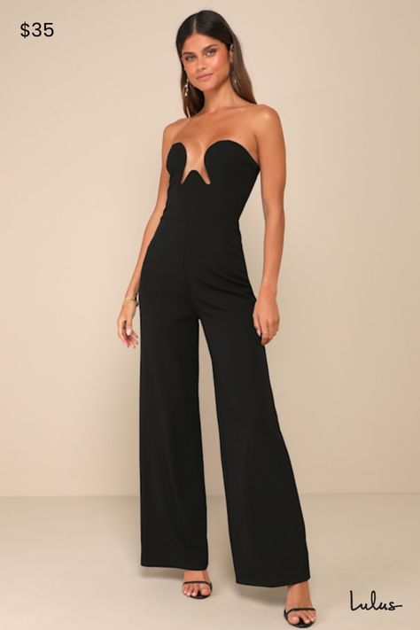 Step out knowing your 'fit is totally stunning when you wear the Lulus Sultry Composure Black Strapless Wide-Leg Cutout Front Jumpsuit! Stretchy techno-crepe knit shapes a strapless bodice with hidden no-slip strips and a wire-line cutout at the front that creates a neckline with a sweetheart effect. Fitted waist tops wide legs that end at ankle-length hems. Hidden zipper/clasp at back. Fit: This garment fits true to size. Length: Floor length. Bust: Great for any cup size. Waist: Fitted - very fitted at natural waist. Hip: Fitted - stretchy fabric allows room for hips. Undergarments: May be worn with petals, or no bra. Fabric: Fabric has some stretch. Lined. Shell: 95% Polyester. 5% Spandex. Lining: 100% Polyester. Hand Wash Cold. Do Not Bleach. Line Dry. Iron Low Heat. Imported. Lulus | Black Strapless Bodysuit, Jumpsuit Wedding Guest, Homecoming Outfits, Wedding Jumpsuit, Strapless Jumpsuit, Wide Legs, Guest Dresses, Hidden Zipper, Ankle Length