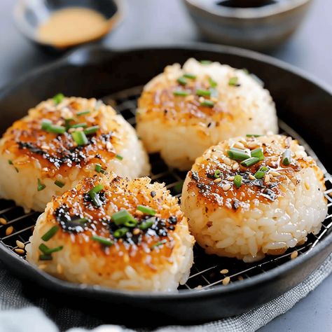 If you’re a fan of Japanese cuisine and looking for a twist on the classic rice ball, then this recipe for Miso Butter Grilled Rice Balls is just the adventure ... Read more Nori Rice Balls, Rice Balls For Kids, Sushi Rice Balls, Healthy Japanese Food, Grilled Rice Balls, Rice Beer, Miso Rice, Dorm Recipes, Unique Side Dishes