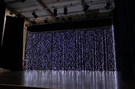 Curtains of fairy lights for a dramatic backdrop on the stage, set ready for the band. Glitter Curtains, Concert Stage Design, Dark Curtains, Interior Design Plan, Blue Fountain, Light Backdrop, Church Stage Design, Church Stage, Stage Backdrop