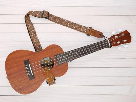 Are you ready to make sweet music? If you love playing the ukulele, you are sure to spend several hours at a time strumming away. However, trying to support your ukulele while you play can be uncomfortable at times, especially if you own a heavier model. Fortunately, you can easily solve this problem by investing … Top 7 Best Ukulele Straps in 2021 Reviews Read More » The post Top 7 Best Ukulele Straps in 2021 Reviews appeared first on Old-Time Music. Ukulele Sizes, Vintage Camera Strap, Cool Ukulele, Ukulele Straps, Guitar Ukulele, Alphabet Stamps, Camera Straps, Guitar Accessories, Ukelele