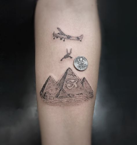 Skydiving to The Pyramids of Giza  Tattoo  Done by @themanyao Skydiver Tattoo, Pyramid Tattoos, Luke Tattoo, Skydiving Tattoo, Tricep Tattoo, Koi Tattoos, Holiday Tattoo, Egyptian Eye Tattoos, Pyramid Tattoo