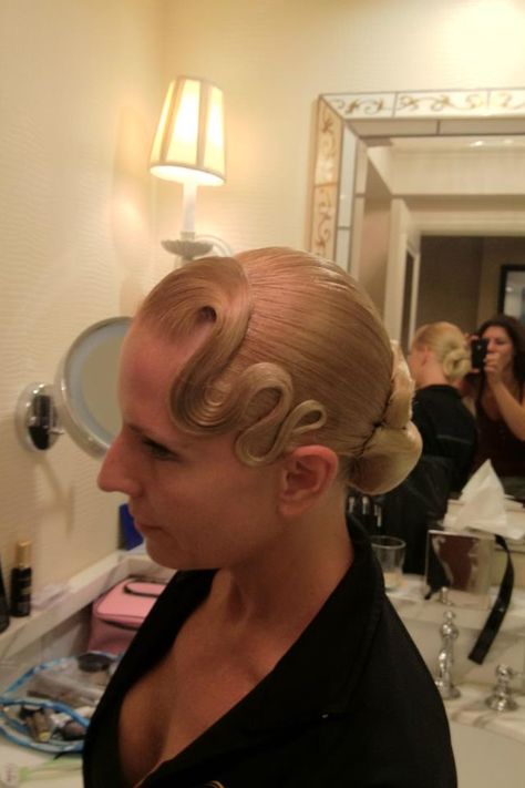 Simple swirl bun with front accent waves. No stones (yet). Good hairstyle for Standard and Latin. Visit http://ballroomguide.com/comp/hair_make_up.html for more hair and makeup info Latin Ballroom Hairstyles, Swirl Bun, Dancing Hairstyles, Ballroom Makeup, Ballroom Hairstyles, Ballroom Dancing Hairstyles, Dancesport Hair, Ballroom Dance Hair, Celebrity Event