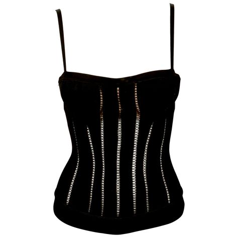 Black knit corset top with decorative stitching and attached padded push-up bra designed by Azzedine Alaia dating exactly as seen on the fall 1991 runway and countless editorials. Labeled a Size 'S' and best fits an XS or S. Made in Italy. Center back brass zipper. Fabric content: 90% viscose, 6% nylon, 4% spandex. Excellent condition. Corset Runway, Alaia Mini, 90s Corset, Knit Corset Top, Knit Corset, Corset Top Black, Runway Top, Vintage Bustier, Azzedine Alaïa