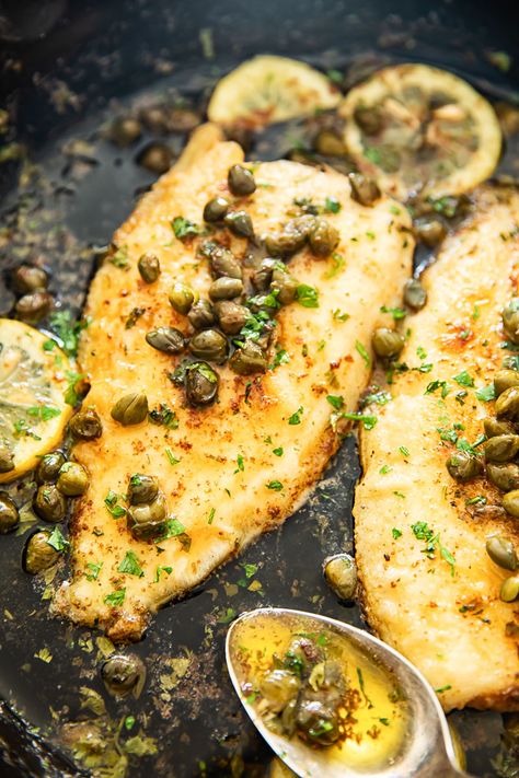 Tender sole fish cooked in a lemon butter sauce with capers. A classic Sole Meuniere recipe that comes together in minutes! Fish With Capers Butter Sauce, Fish Meuniere Recipe, Fish Capers Lemon Recipe, Lemon Sole Fish Recipe, Tilapia With Capers And Lemon, Lemon Caper Fish Recipe, Fish With Capers And Lemon, Fish And Capers Recipe, Lemon Caper Fish