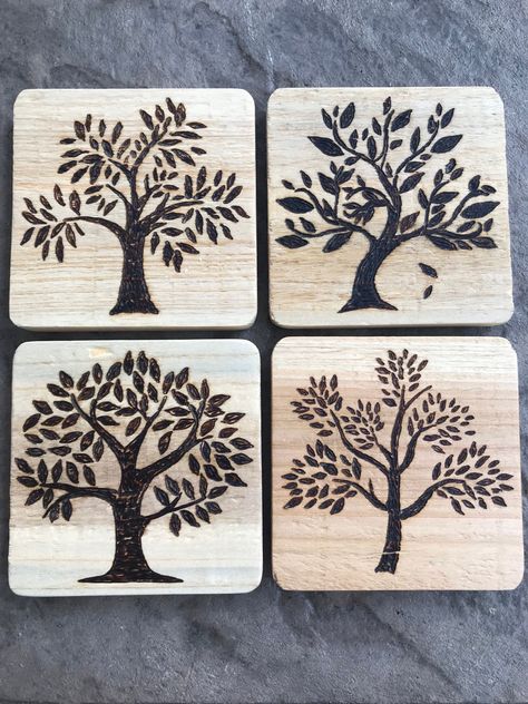 This set of 4 hand wood burned coasters features 4 different tree designs.  Each coaster measures 4 x 4 x 1/2, is light weight and has been finished with paste wax for protection from moisture.  Additionally, the underside of each coaster has small felt circles on each corner to protect your table or counter top.  Choose this set as the perfect gift for your tree loving friend as they move into their first new home.  Ladies, looking for the perfect, useful gift for him on your 5th (wood) anniver Wood Burned Coasters, Coasters Wood, Stocking Stuffers For Adults, Wood Anniversary, Wood Burning Crafts, Anniversary Gift For Him, Wood Burning Patterns, Mothers Day Gifts From Daughter, Wood Burning Art