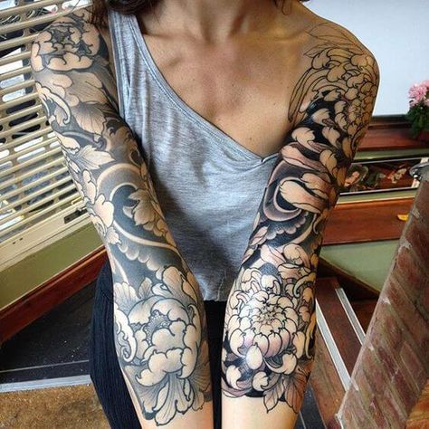 For those gals out there who simply cannot be satisfied with a tattoo on a single arm, this design is meant for you. The tattoo is in shades of black and white and its composition includes dreamy and divine drawing of flowers against a soulful backdrop. #tattoofriday #tattoos #tattooart #tattoodesign #tattooidea Woman Japanese Tattoo Sleeve, Chrysanthemum Tattoo Sleeve, Chinese Sleeve, Tatuajes Irezumi, Geisha Tattoos, Many Tattoos, Chrysanthemum Tattoo, Irezumi Tattoos, Traditional Japanese Tattoos