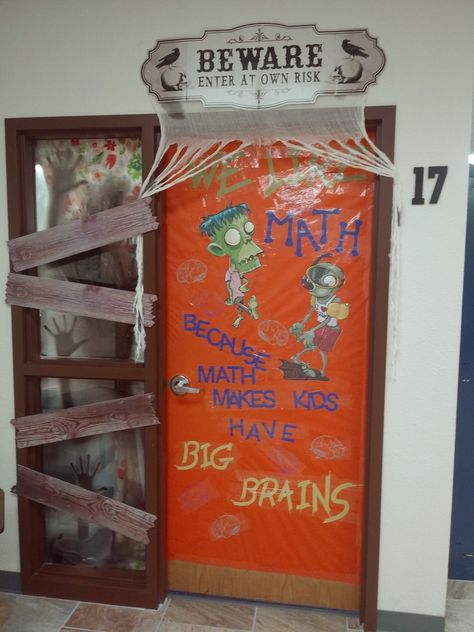 Middle school math Halloween classroom door. Zombies and brains. Credit to Plants vs. Zombies for the adorbs zombies. Credit for my school library media specialist for the prints. Zombie Door Decorations For School, Zombie Classroom Door, Zombie Door Decorations, Math Classroom Door, Halloween Door Decorations Classroom, Halloween Classroom Door, Preschool Classrooms, Halloween Classroom Decorations, Classroom Door Decor