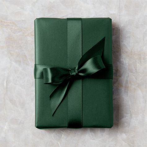 Dark green double-faced satin ribbon sports a lustrous sheen on both sides. Looks especially festive and chic when paired with our dark green gift wrap for a tonal effect. CB2 exclusive.  -Satin -1.5andamp;quot; wide -10 yards -Made in Vietnam Dark Green Holiday Ribbon Green Wrapping Paper, Modern Christmas Ornaments, Black Wrapping Paper, Unique Holiday Decor, Modern Christmas Decor, Christmas Stocking Holders, Holiday Ribbon, Holiday Garlands, Glass Christmas Tree Ornaments