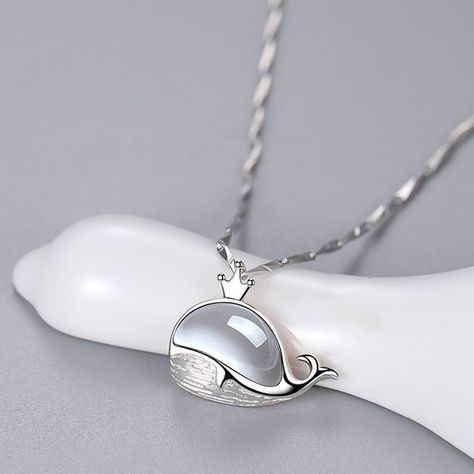 This necklace features a crowned whale pendant adorned with a white gemstone, combining elegance and a touch of whimsy. #WhaleNecklace #WhiteGemstone #ElegantJewelry #OceanInspired #SilverJewelry #WhimsicalDesign Whale Pendant, Whale Necklace, Ocean Inspiration, Elegant Jewelry, Silver Jewellery, Silver Jewelry, Gemstones, Pendant, Silver