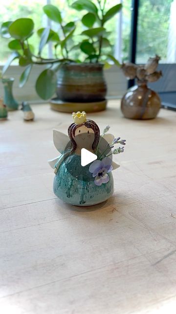 Little Garden Pottery 🌿🐝 on Instagram: "We are currently working on getting our website up and running again with some new products but are waiting for some shipping supplies, so I’m back in the studio making some fairy bud vases! She holds water and a small bunch of flowers. I’ve had this fairy princess prototype for a long time and I’ve been itching to make some more to sell once the boy was back in school. Stay tuned ! 

🧚🏻💕✨

#potterystudio #ceramicart #fairycore #fairyvase #budvase #fairygarden #potterylove #ceramicstudio #cutegifts #fairygifts #naturelover #gardenfairy #cottagecore #potteryvideos #pottersofinstagram #originalart #porcelain #wheelthrown" Pottery Angels, Pottery Videos, Fairy Gifts, Garden Pottery, Fairy Princess, Fairy Princesses, Shipping Supplies, Little Garden, Ceramic Studio