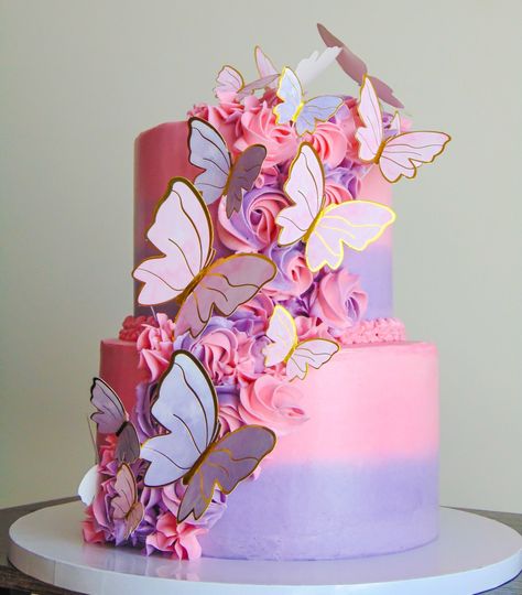 Pink and purple butterfly theme cake Pink And Purple 2 Tier Cake, 2 Tier Birthday Cake Butterfly, 2 Tier Butterfly Cake Ideas, Butterfly Cake Ideas 1st Birthday, Pink Purple And White Cake, Purple And Gold Butterfly Birthday, Encanto Two Tier Cake, Two Tier Cake For Girl, Beautiful Sheet Cakes Birthday