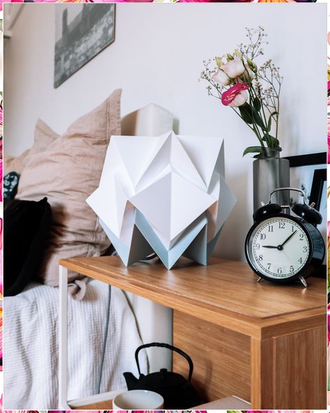 Looking to add a touch of creativity to your space? Try making your own DIY Origami Lamp! This stunning paper folding craft will not only illuminate your room but also add a unique and personalized touch to your decor. Follow our step-by-step tutorial to create your own origami lamp and brighten up your space in style. Perfect for craft lovers and those looking to add a handmade touch to their home decor. Origami Table, Origami Lights, Japanese Paper Lanterns, Paper Folding Crafts, Origami Lamp, Relaxing Atmosphere, Diy Origami, Craft Lovers, Paper Folding