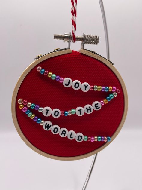 This sweet 3" beaded embroidery hoop art Christmas ornament showcases lyrics from a holiday song and is sure to spread holiday cheer. It's made from beads, upcycled fabric, felt, and an embroidery hoop. Free regular mail delivery (not tracked) is included in the price. Letter Bead Christmas Ornaments, Hoop Ornaments Diy, 2024 Diy Christmas Ornaments, Diy Embroidery Christmas Ornaments, Beaded Felt Ornaments Diy, Bead Embroidery Ornament, Felt Hoop Art, Felt Embroidery Christmas Ornaments, Christmas Bead Embroidery