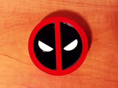 Deadpool Belt Buckle - $30 Don your next Deadpool costume with this amazing belt buckle! Each buckle is made from a light weight plastic and is 3'' in diameter. Buckle can include either a felt backing for easy attachment to the costume item of your choice or metal backing for everyday wear. Metal backing will fit 1 1/2'' to 1 3/4'' standard belt. Deadpool Belt, Felt Plushies, Deadpool Costume, Deadpool Cosplay, Halloween 2015, Gifts For Hunters, How To Make Paint, Boy Costumes, Boys Bedroom