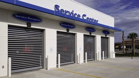 Mechanic Shop Decor, Car Showroom Design, Commercial Garage Doors, Commercial Design Exterior, Overhead Garage Door, House Outer Design, Warehouse Design, Metal Doors, Storefront Design