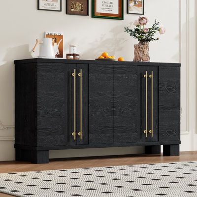 Our sideboard is crafted with a traditional-special style that exudes natural elegance. Its clean lines and soothing natural tones are sure to be a striking focal point in any living space. The table's overall level offers a refreshing and balanced look. Mercer41 Color: Black | Mercer41 Vernece 60 Sideboard gray / Wood in Black | 33.8" H X 60" W X 15.7" D | Wayfair Console Table Entryway, Style Sideboard, Wood Storage Cabinets, Kitchen Sideboard, Brown Living Room, Wood Sideboard, Gold Handles, Sideboard Cabinet, Dining Room Living Room