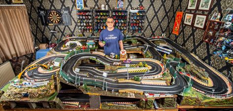 MOTOR racing fan Tony Sivyer has built a Scalextric track 165ft long — in his spare room. Tony, 53, from Bournemouth, spent six years and £10,000 on the 12ft by 8ft layout. He said: “I’m not good at engineering so it’s been a challenge.” The track has also has a “Monaco grand prix” tunnel and […] Scalextric Track, Slot Car Race Track, Airfix Models, Track Pictures, Scalextric Cars, Warehouse Worker, Slot Car Racing, Slot Car Tracks, Monaco Grand Prix