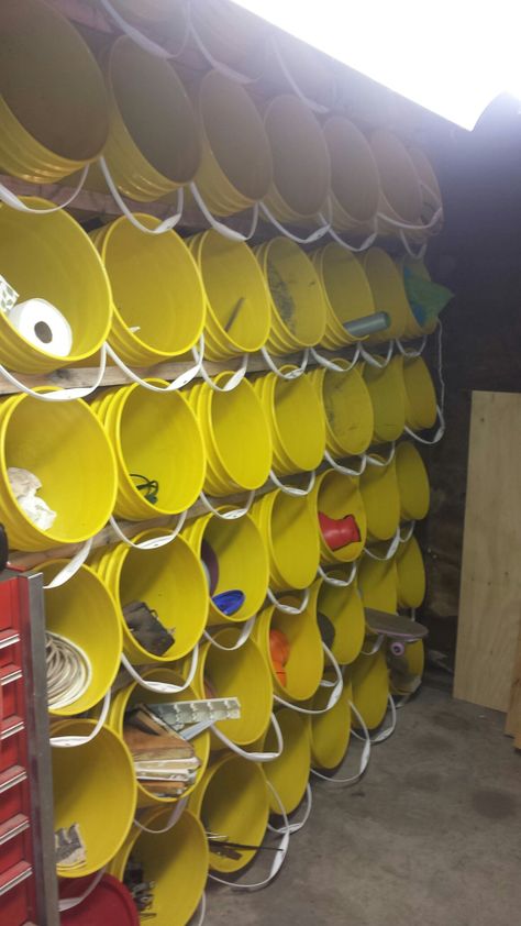 Amazing 5 Gallon bucket storage wall ideas for your garage or craft supplies. 7 x 7 for a total of 49 buckets. Removable and self supporting. Built by Sarah Haringa scaffolding pics available. Storage Wall Ideas, Shed Storage Ideas, Bucket Storage, Garage Organisation, 5 Gallon Buckets, Storage Shed Organization, Garage Workshop Organization, Shed Organization, Basement Storage