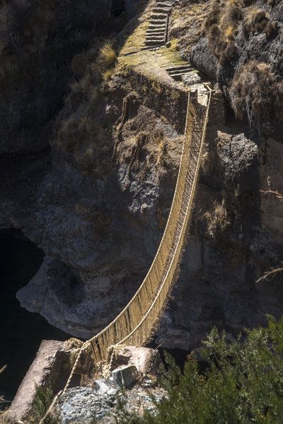 A suspension bridge made of twisted plant fibers stretches high above the Apurimac River in Peru. Local residents, descendants of the Inca, have been making bridges like this for some 500 years. Rope Bridge, Dangerous Roads, Scary Stuff, Cusco Peru, Body Of Water, Peru Travel, Suspension Bridge, 12 Weeks, Machu Picchu