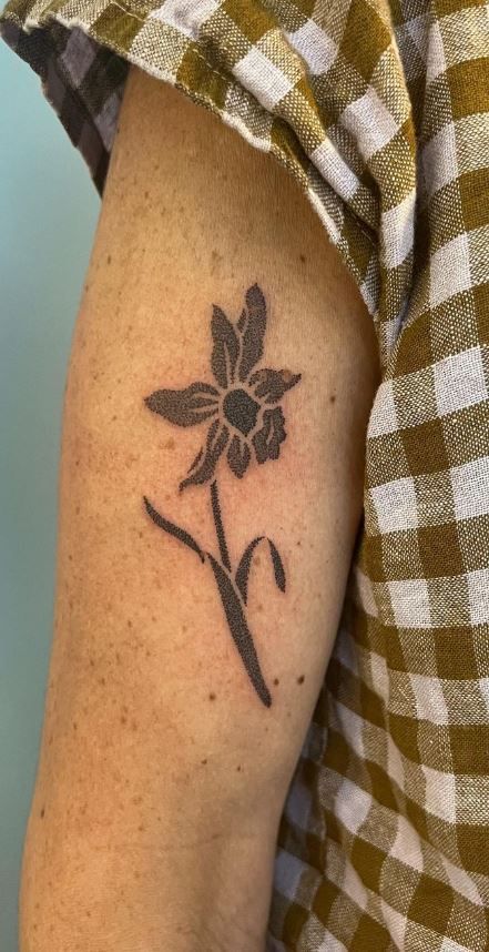 Black Filled Tattoo, Adonis Flower Tattoo, Earthy Arm Tattoos, Tattoo Ideas Daffodil, Small Black Ink Tattoos, Forearm Tattoos Flowers, Dianthus Tattoo, Wrap Around Elbow Tattoo, Men’s Flower Tattoo