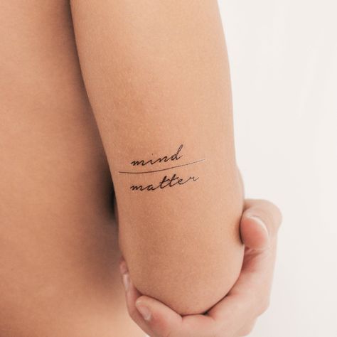 Mind over matter temporary tattoo. Set of three. Size: 1.7 in / 4.4 cm (width) This temporary tattoo is: * Safe & non-toxic * FDA-compliant and fun for all ages * Free shipping in order over €10: FREESHIPPINGOVER10 * 20% off when you buy 3 items (+ Free Shipping ): THREE Temporary Small Tattoos last on average 2-5 days. We suggest placing on oil-free areas where skin does not stretch and keep them clean! Phrase Tattoos For Women, Mind Matter Tattoo, Everything Is Temporary Tattoo, Small Phrase Tattoos, Small Phrase Tattoos For Women, Healer Tattoo, Under Collar Bone Tattoos, Mindfulness Tattoo, Mind Over Matter Tattoo