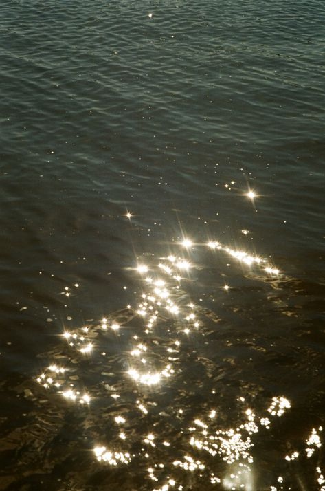 Magical Waters is an evocative piece that captures the mesmerizing beauty of sunlight reflecting on the surface of water. Taken as part of my unedited analogue photography series, this fine art print reveals a scene of shimmering sparkles dancing across the water, creating a dreamlike, almost magical atmosphere. The delicate interplay of light and water invites the viewer to lose themselves in a moment of natural wonder. Printed on premium fine art paper, Magical Waters is available as a limited Glow Water, Water Magic, Analogue Photography, Mesmerizing Beauty, Aesthetic Fonts, Photography Series, Water Reflections, Water Element, Limited Edition Prints