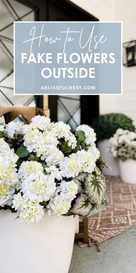 Transform your outdoor spaces with the magic of faux flowers. Learn how to use fake flowers outside to create stunning arrangements that withstand the elements. With a little creativity, you can craft beautiful displays that add a touch of elegance to your patio, balcony, or garden. Say goodbye to wilting blooms and hello to year-round beauty! #artificialplants #outdoorliving #easygardening Fake Plants Porch, Fake Flowers For Outside Pots, Faux Plants Around Pool, Faux Outdoor Flowers, Using Fake Flowers Outdoors, Outdoor Fake Flower Pot Ideas, Spring Porch Pots, Faux Flowers Outdoors, Fake Flowers Outside