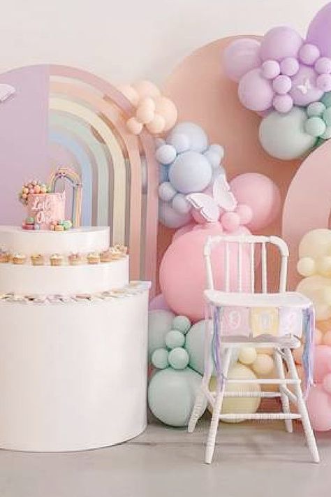 Take a look at this gorgeous pastel rainbow birthday party! The highchair is so cute!! See more party ideas and share yours at CatchMyparty.com Pastel Theme First Birthday, Pastel Rainbow One Year Old Party, Pastels Theme Party, Pastel Colour Birthday Theme, Pastel One Year Old Birthday, Pastel Colors Birthday Theme, Rainbow One Year Old Party, Pastel Rainbow Balloon Garland, Pastel Color Birthday Party Ideas