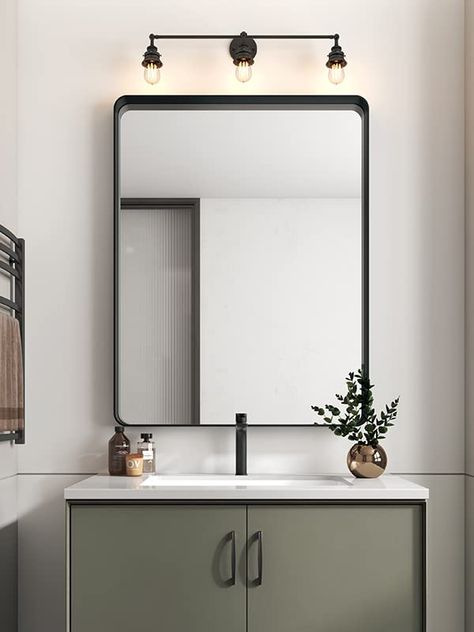 PRICES MAY VARY. Firm Glass 【Craftsmanship】Our shatter-proof mirror reflects images accrately, gives your bathroom a new modern look. 【Easy Installation】Just measure the two holes in the back of the lightweight mirror, set screws on wall and mount. 【Spacious】The rounded edges and the matte black frame is a nice neutral used in the mirror, suitable for contemporary, modern, traditional and farmhouse style. 【Elegant】This is a mirror that will ''modernize'' your space, a mirror for your bathroom re Black Frame Bathroom, Frame Bathroom Mirror, Black Bathroom Mirror, Living Room Vanity, Frame Bathroom, Modern Bathroom Mirrors, Black Vanity Bathroom, Mirror For Wall, Black Mirror Frame