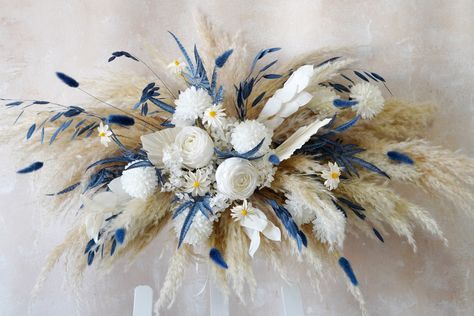 Dusty Blue White Flower Arch Arrangement,Boho Wedding Arch Flower,Faux Flower Wedding Arrangement,Navy Blue Wedding Arch Flower,Wedding Arch 🎈🎈Because the size of the arch flower is large, we usually pack the palm leaves and Pampas grass separately. When you receive them, please insert them according to the picture, which can effectively avoid damage to it during transportation, please understand. 💖Gorgeous wedding corner swag!💖 Contains natural pampas grass and palm leaves, as well as beaut Dusty Blue Wedding Theme Backdrop, Navy Blue Wedding Theme Decoration, Navy Blue Wedding Arch, Dusty Blue Wedding Decorations, Navy Blue Wedding Flowers, Dusty Blue Boho Wedding, White Flower Arch, Blue Wedding Arch, Blue Boho Decor