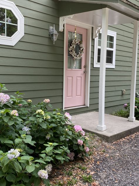 Pink Front Door Cottage, Green House Pink Front Door, Pink Vintage House Exterior, Sage Green House Door Color, Sage Green Exterior House Pink Door, Soft Pink House Exterior, Green House With Pink Door, Houses With Pink Doors, Pastel Green Front Door