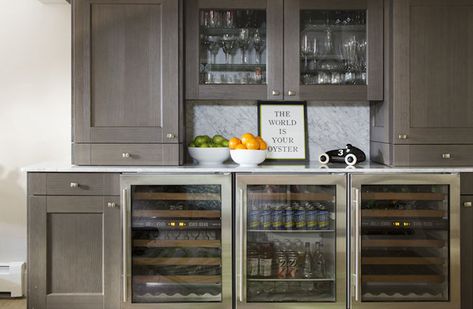 Fantastic bar features brown cabinets paired with white marble countertop and white marble slab backsplash. Glass Front Mini Fridge, Liz Caan, Fridge Ideas, Modern Refrigerator, Glass Upper Cabinets, Fridge Design, Beverage Fridge, Glass Refrigerator, Grey Countertops