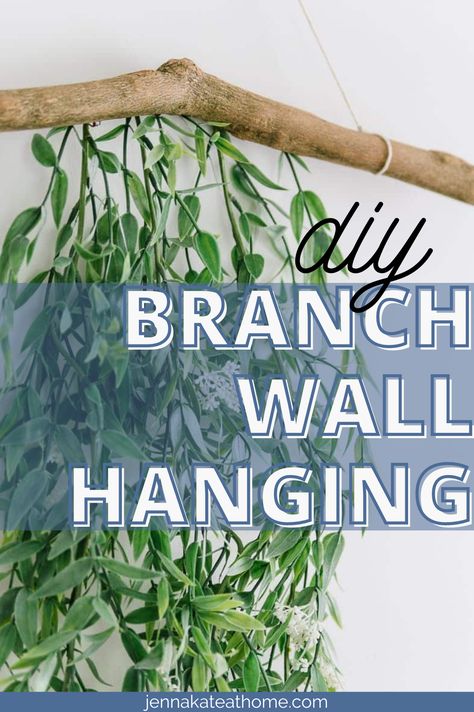 This simple wall hanging idea with a branch and greenery is the perfect way to add a touch of color to any room in your home. Plus, it's incredibly easy to make! How To Hang A Branch On The Wall, Greenery Around Mirror, Greenery Above Bed, Greenery On Wall, Hanging Branch Decor, Grad Banquet, Branch Wall Hanging, Easy Diy Wall Hanging, Greenery Wall Decor