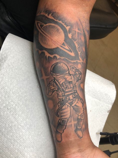 Astronaut with Saturn tattoo outer space Space Forearm Tattoo Men, Astronaut Tattoos For Men, Space Filler Tattoo Sleeve, Astronaut Leg Tattoo, Men’s Space Tattoo, Tattoo Of Saturn, Mens Space Tattoos, Outer Space Tattoo Ideas, Astronaut Sleeve Tattoo