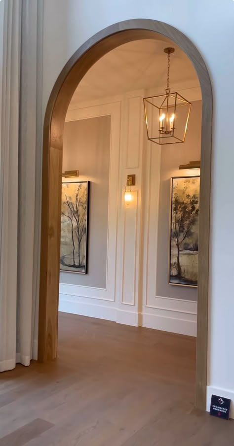 Grand Entrance Home, House Walkway Entrance Inside, Diagonal Interior Design, Arch House Design Interior, Tall Corner Fireplace Wall High Ceilings, Modern Cozy Home Decor, Vaulted Ceiling Wall Panelling, Historic Homes Interior Decor, Archway Lighting