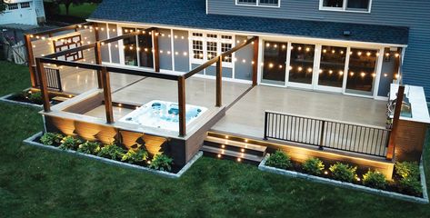 Simple details were included in the design of this contemporary deck to improve access to its hot tub and outdoor kitchen. Hot Tub And Outdoor Kitchen, Swim Spa Landscaping, Deck With Hot Tub, Wooden Deck Designs, Deck Skirting Ideas, Corner Deck, Skirting Ideas, Trek Deck, Spa Landscaping