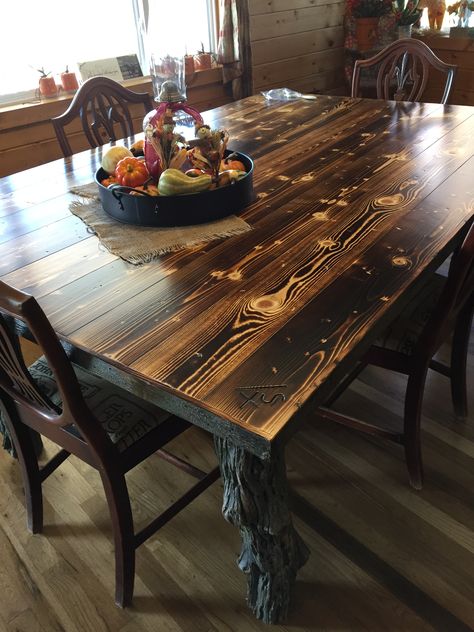 Dining room table made out of old cedar fence post and coral rails.  Burned and distressed the pine planks. Cedar Dining Room Table, Cedar Dining Table, Cedar Fence Posts, Burnt Wood Finish, Furniture Build, Farmhouse Life, Torch Wood, Cabin Porch, Cedar Planks