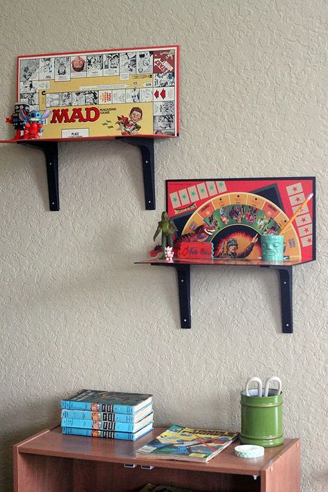 Dvd Stand Ideas, Board Game Wall Shelf, Funky Display Ideas, Diy Decor For Men, Home Decor Upcycle, Board Game Wall Decor, Eclectic Diy Decor Ideas, Thrifted Diy Decor, Boardgame Shelf Ideas