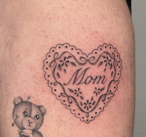 Tiny Seal Tattoo, I Heart Mom Tattoo, Mom In Heart Tattoo, Mom Heart Tattoo Designs, Doily Heart Tattoo, Mother Inspired Tattoos, Heart Doily Tattoo, Mom Heart Tattoo Traditional, Mom Heart Tattoos