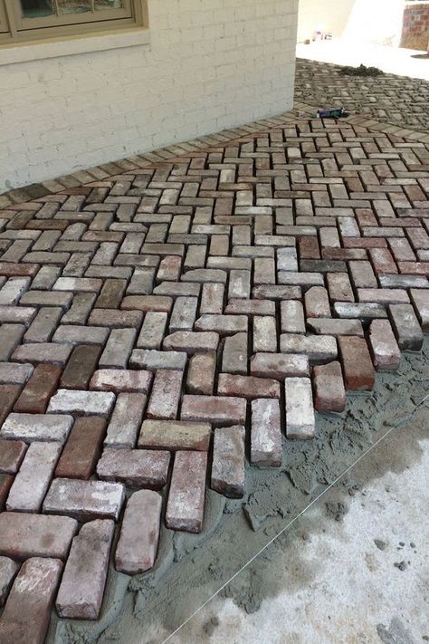 This walkway design made with red bricks is an easy approach to prevent the walkway from dirt and rain. An easy and simple idea to bring newness in the house. Place the bricks in a way you like on the ground and increase the worth of your outdoor space. Brick Driveway, Brick Paver Patio, Brick Pathway, Walkway Landscaping, Walkway Design, Brick Walkway, Reclaimed Brick, Garden Paving, Desain Lanskap