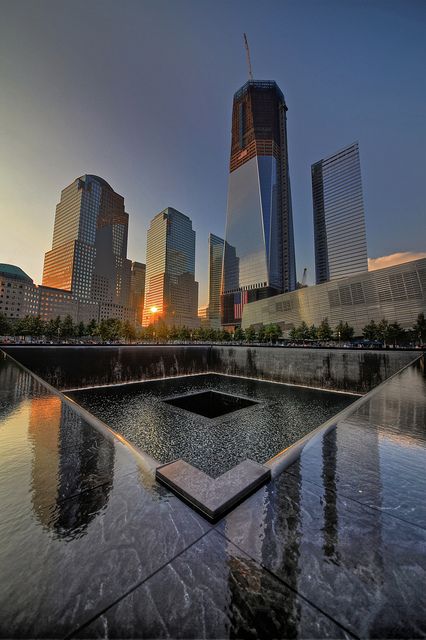 One World Trade Center building in-progress (circa 2012) and reflections in the South Memorial Pool at the National September 11 Memorial. #wtc #nyc #911memorial #september11th Nine Eleven Memorial, Photographie New York, Travel Honeymoon, Voyage New York, Ville New York, Twin Towers, Nyc Trip, City That Never Sleeps, Trade Center