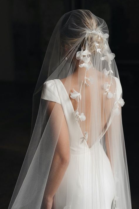 *Enjoy 10% off for a limited time. Use coupon code LIMITED10 at checkout. Does not include bespoke or custom changes. We took inspiration from the ornamental orchid flower and carried it across to adorn this sculptural beauty. For brides seeking a touch of classic styling, the Orchid veil blends drama with fluidity, accentuated by delicate lace, 3D fabric flowers and delicate hand beading. Dramatically decadent yet effortlessly ethereal, this is a veil that speaks to beauty, timeless appeal and 3d Fabric Flowers, Floral Wedding Veil, Unique Wedding Veils, Floral Wedding Veils, Embellished Veil, Embroidered Veil, Lace Cathedral Veil, Ivory Bridal Veil, 3d Fabric