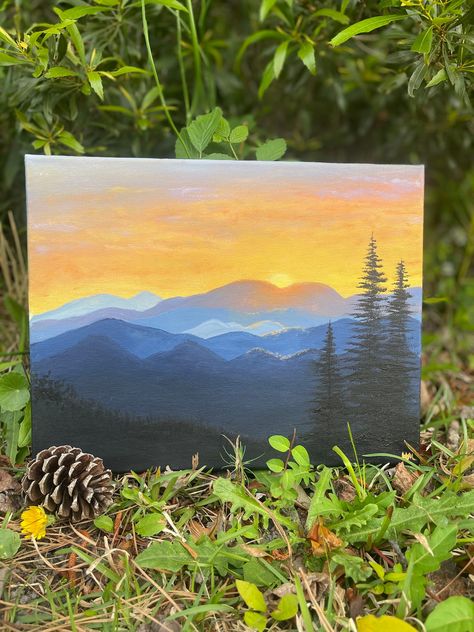 Painting of a sunset in the mountains  Mountain sunset painting on canvas Mountain With Trees Painting, Canvas Painting Mountains Easy, Fall Mountain Painting Easy, Easy Mountain Landscape Painting, Mountain Painting On Canvas, Western Sunset Painting, Diy Mountain Painting, Mountain Sunset Painting Easy, Painting Mountains Easy