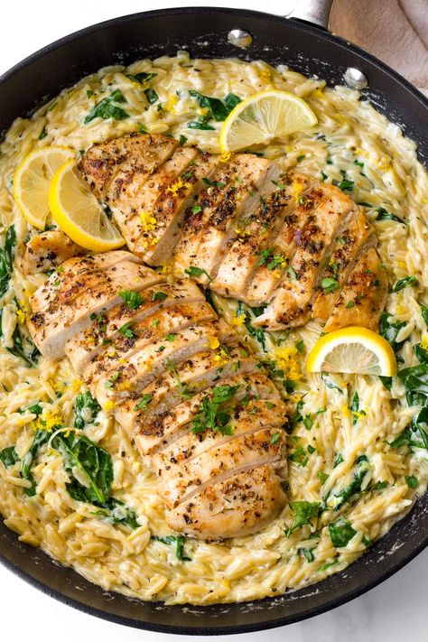 Lemon Chicken Orzo! This creamy one pot lemon chicken orzo is perfect for weeknights, and an amazing comfort food recipe. The orzo is tender, and it's tossed with fresh lemon and spinach. One Skillet Crispy Chicken Thighs & Creamy Lemon Garlic Orzo, Orzo Al Limone With Chicken, Orzo Al Limone Recipe, Orzo Cooked In Chicken Broth, Dinners With Orzo, Healthy Orzo Meals, Lemon Chicken Orzo Crockpot, Lemon Garlic Chicken Orzo, Lemon Orzo With Chicken