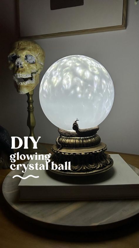 25K views · 2.6K reactions | Project 7 from my Halloween DIY Series and we’re making a Glowing Crystal Ball 🔮 You’ll need: • A base (mine was a thrifted candle pillar, but you can also use a bowl that has been flipped over with the base cut out) • A starlight projector (mine was $29 @kmartaus) • A batten light fitting (you can thrift these or buy from a hardware store for under $20) Optional: • Epoxy glue to glue the lampshade to the base (not necessary but handy to secure it) • Apoxie Scu Rub N Buff Antique Gold, Starlight Projector, Glowing Crystal, Apoxie Sculpt, Halloween Potion Bottles, Rub N Buff, Halloween Bedroom, Halloween Witch Decorations, Epoxy Glue