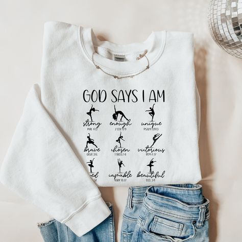 Ballet Dance Bible Verse Sweatshirt, Custom Dance Apparel, Christian Dance Shirt, Dance for Jesus, Christian Sweatshirt, Gift for Dancer, God Says I Am Strong, Unique, Enough, Brave, Chosen, Victorious, Loved, Capable, Beautiful The Gildan 18000 sweatshirt is made from a heavy blend of cotton and polyester, making it perfect for any situation. The ribbed knit collar will keep your neck warm, and the garment is machine-washable, so you can be sure it will look fresh and beautiful even after repeated washes.  CARE INSTRUCTIONS: Turn the sweatshirt or hoodie inside out. Machine wash cold with mild detergent. Tumble dry very low. Do not use bleach. Do not iron directly on design. OTHER IMPORTANT INFO ---------------------------------------------------------------------------------------------- Ballet Shirt Ideas, Gymnastics Sweatshirts, Dance Shirts Ideas, Dance Hoodies, Dance Apparel, Dance Shirt, Gymnastics Gifts, Dance Shirts, God Says